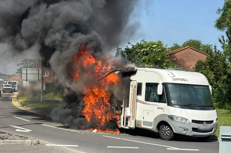 Caravan breakdown and emergency assistance on a summer road — fire safety starts with regular checks before you travel